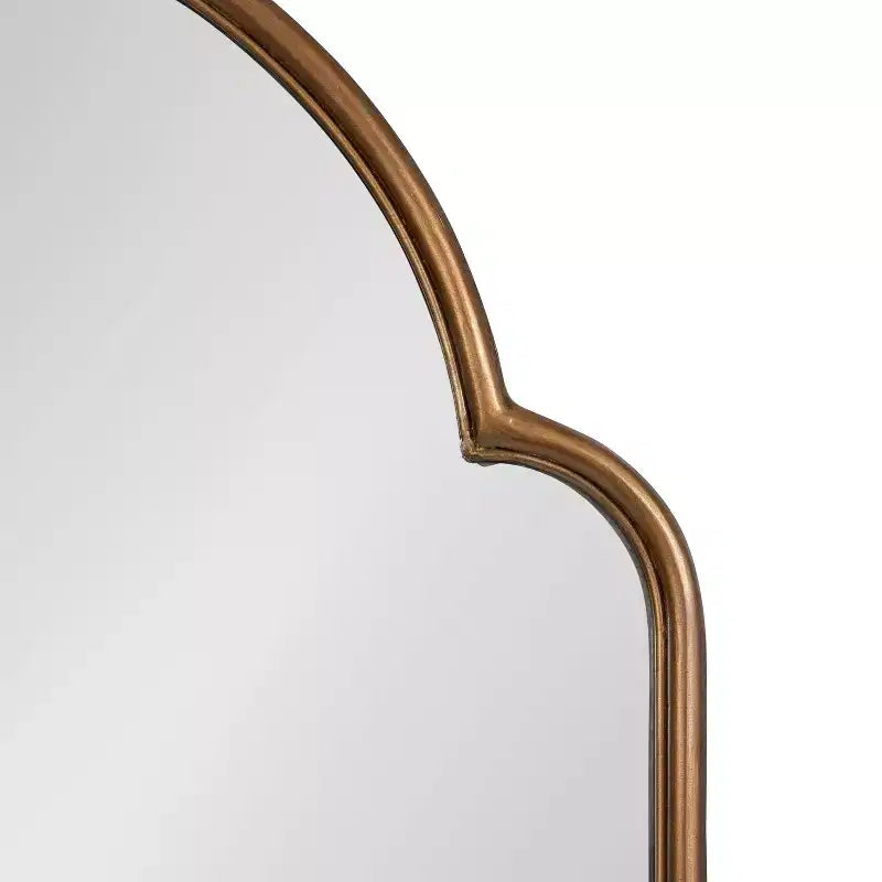 Miroir arche en métal doré
