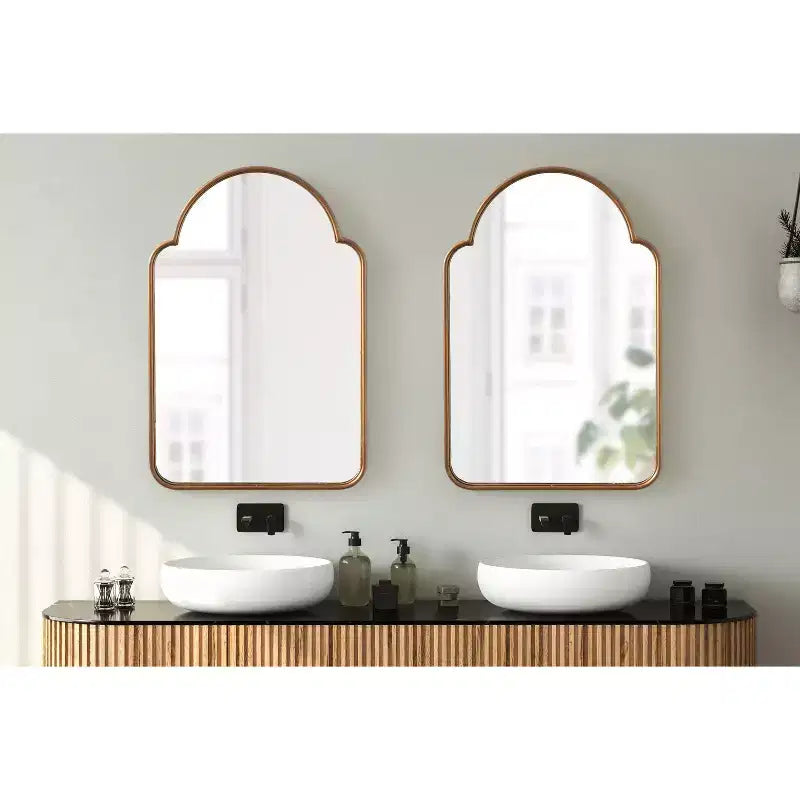 Miroir arche en métal doré